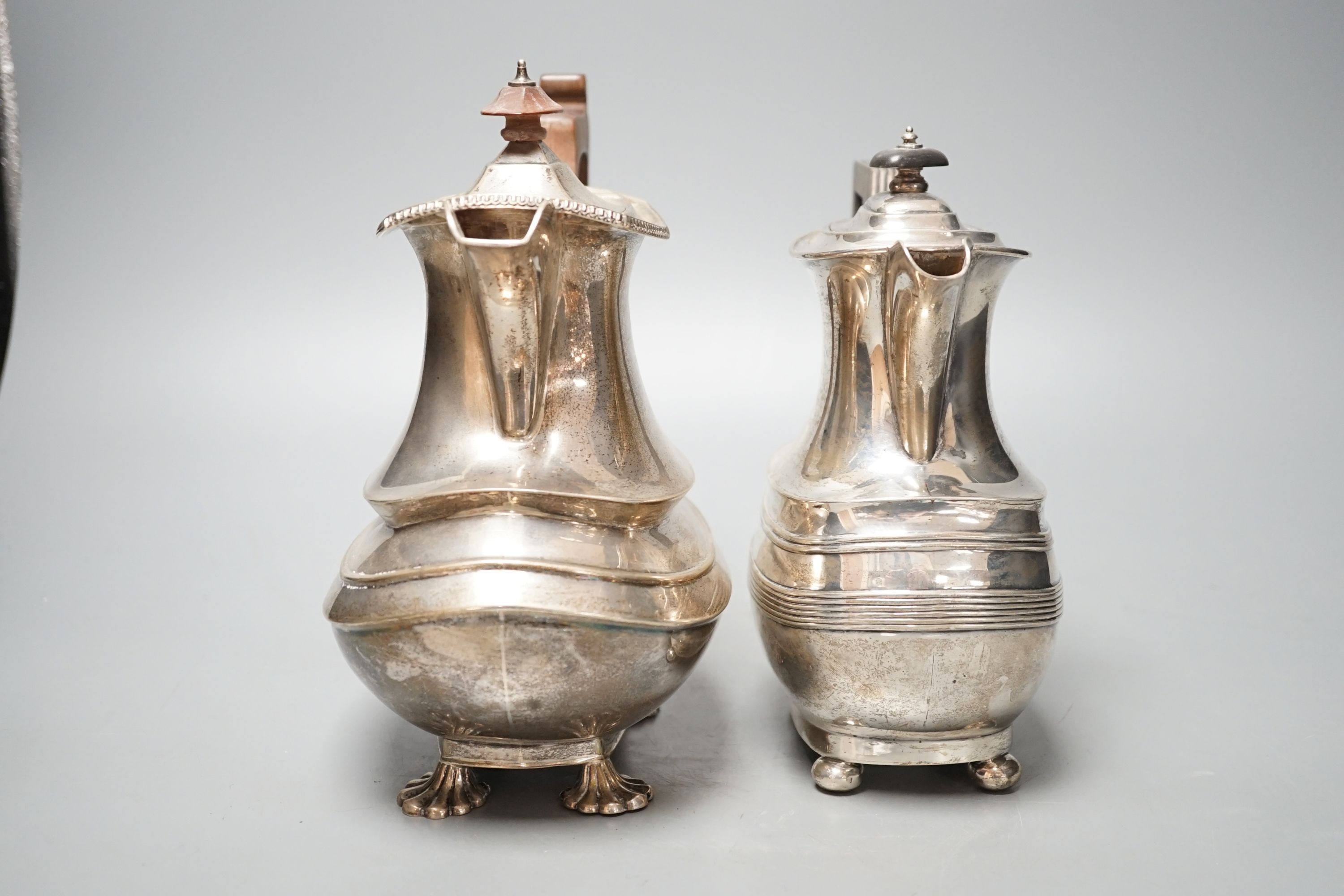 Two George V silver hot water pots, gross 39oz.